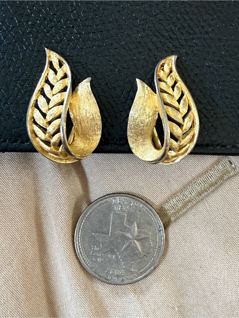 Vintage Trifari gold-tone abstract leaf design clip-on earrings with crown mark